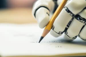 A robotic hand holding a wooden pencil and writting